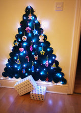 Handmade fabric Christmas tree ornaments, Premium selection, Ornaments on a Christmas tree with lights