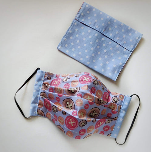 Eco-friendly face mask, face covering made with button themed 100% cotton fabric and a white on baby-blue polka-dot face mask case. Colour: Grey with hot-pink and colourful details